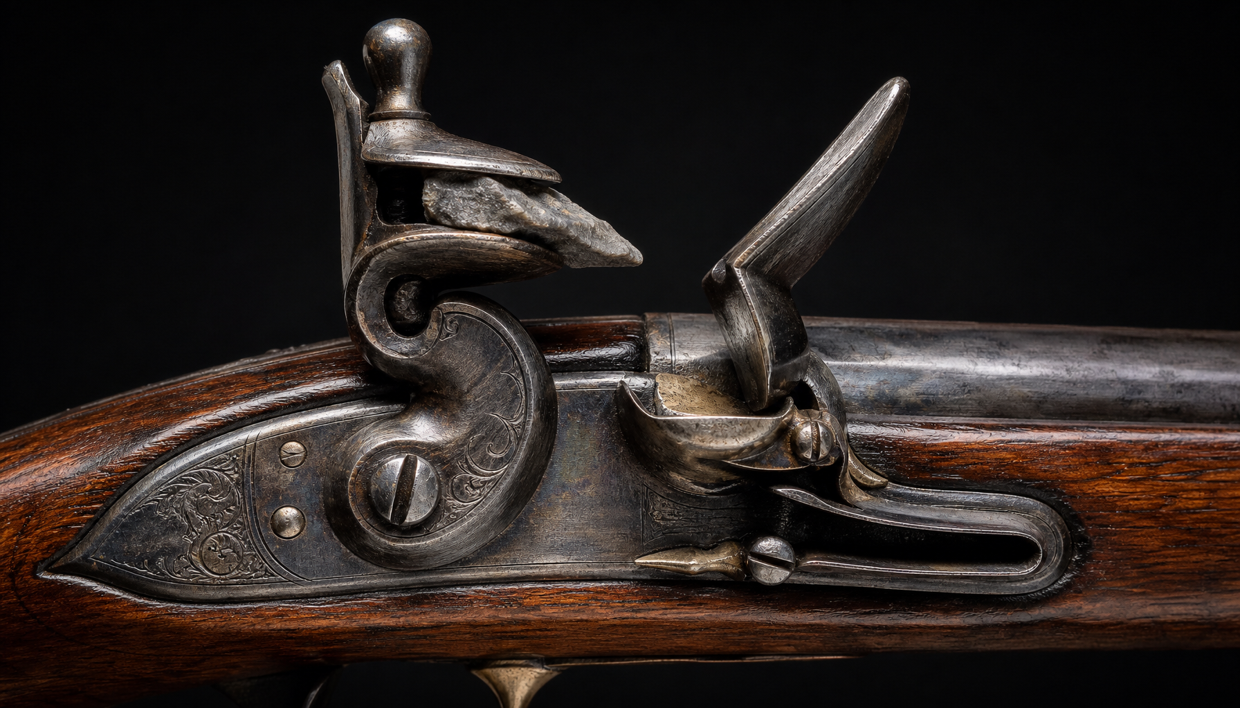 The flintlock, 1600s: flint striking steel, the standard for two centuries.