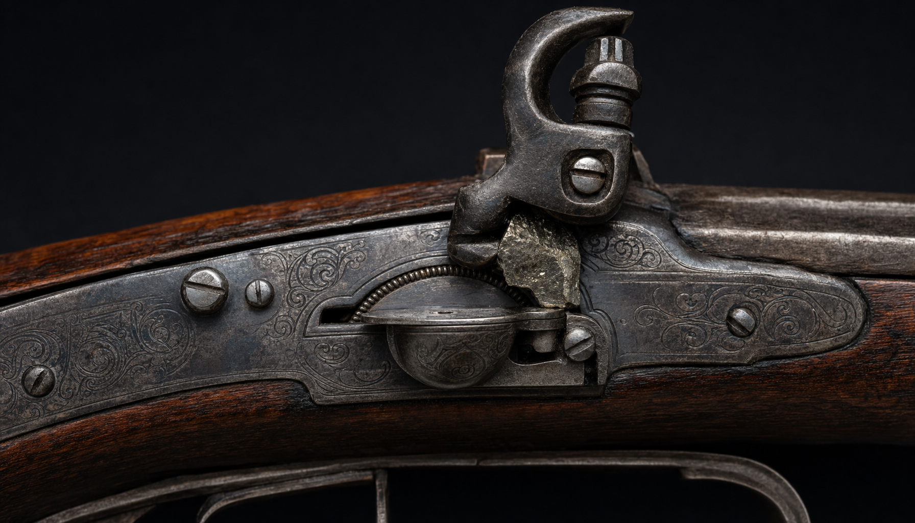 The wheellock, early 1500s: a spring-driven wheel throwing sparks off pyrite, the first self-igniting lock.